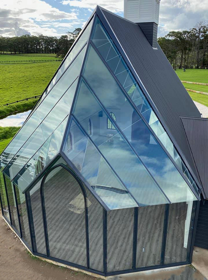 This striking glass facade combines the familiar elements of a gothic arch with abstract shapes more common in very modern architecture.