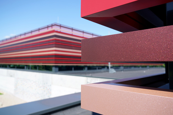 The facade is not only covered in a variety of shades of red, but also vary in how sparkly they are.