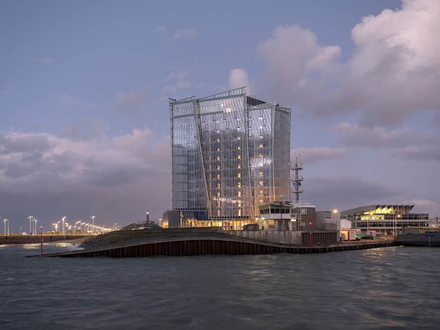 The triangular hotel building stands at the tip of the pier and looks different from every vantage point, no facade side is the same as another.