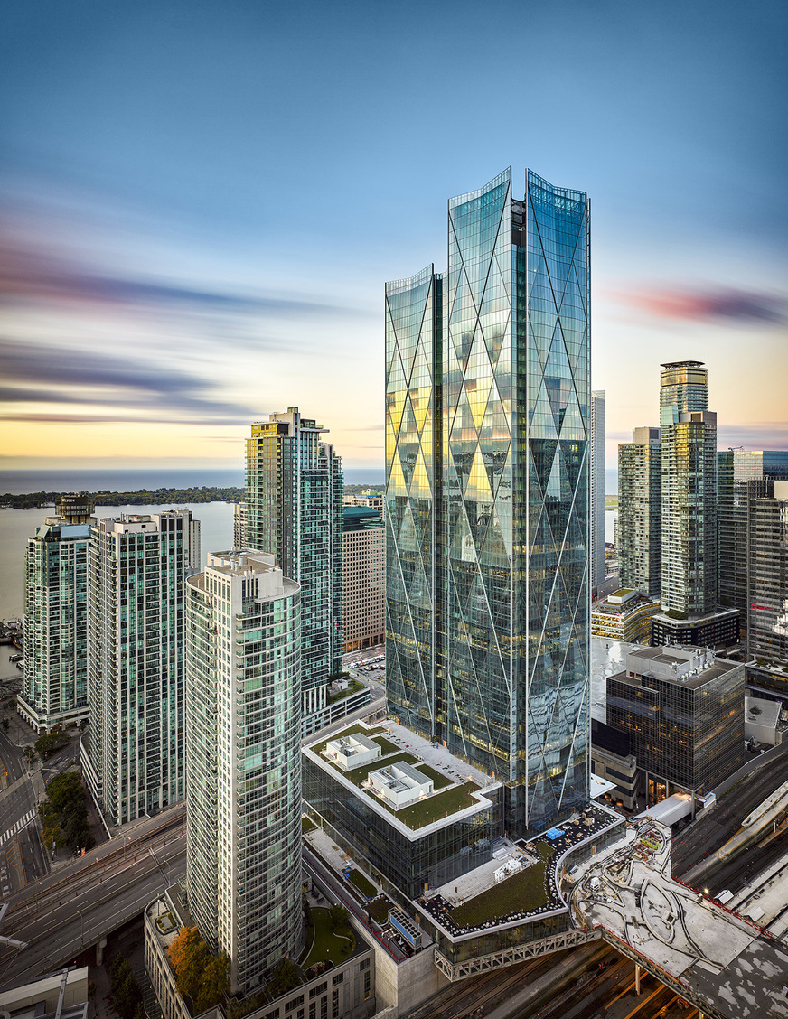 The two towering glass towers will in future dominate the skyline of the Canadian economic centre of Toronto.