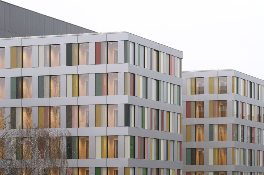 The facade is made of recycled aluminium and coloured glass, and a total of 1300 glass elements were installed.
