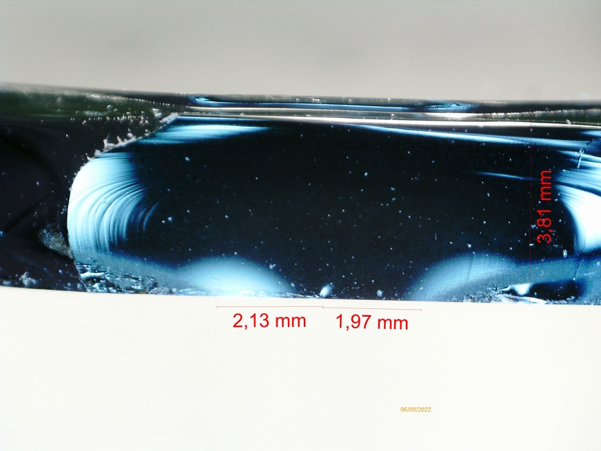 Opening fracture mirror with measurements of the fracture mirror radius. Mean radius of rupture is 2.05 mm ((2.13 mm +1.97 mm)/2).