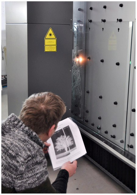 Managing Director Sven Künzel checks on the laser during processing.