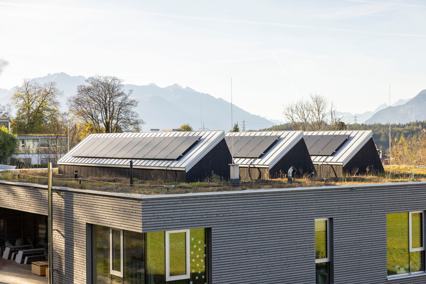 Photovoltaic modules are installed on the rear side of the shed roof light strips facing south.