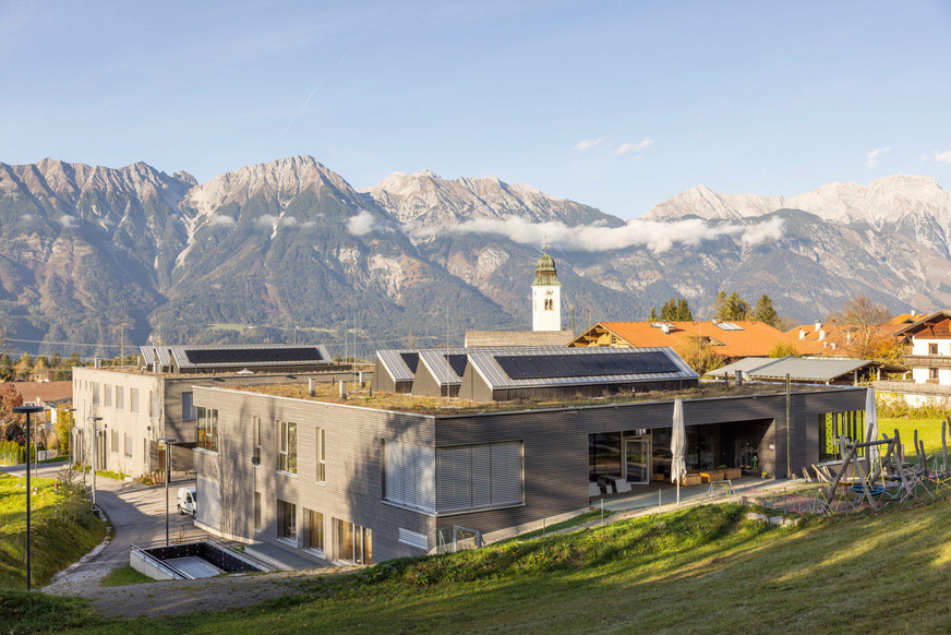 The south-facing backs of the shed roof structures were covered with photovoltaic modules to keep the energy footprint of the school complex as low as possible.