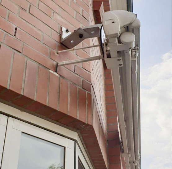 While this awning may stay up longer with this ultra-creative fixing solution, it is unlikely to stand up to calculated inspection at this distance.