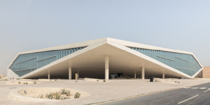 The braced corners of the building provide the facade with the exterior shape of a diamond.