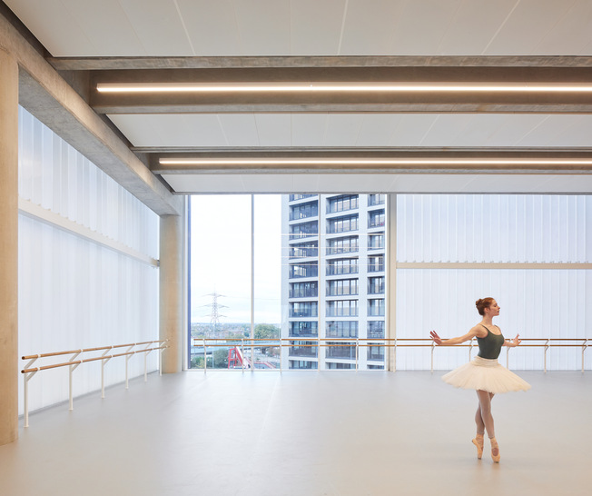 Floor-to-ceiling windows allow a view of the dancers.
