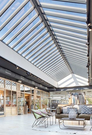 A 20-metre long and 4-metre wide Ridgelight with 64 Velux Modular Skylights supplies the shopping centre with natural daylight. - © Andrea Flak Photography
