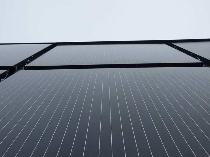 Close-up of the installed photovoltaic elements. They replace the thermal insulation of a facade.
