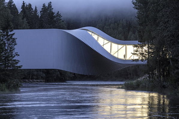 The white cuboid, which spans a river, rotates 90 degrees around its long axis.