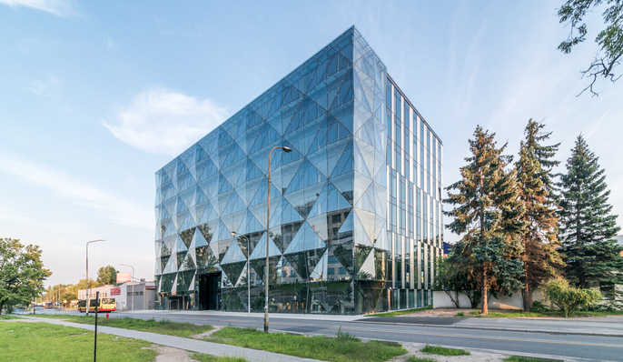 The facade facing the street has many crystal-like surfaces, resembling the facets of a diamond. 