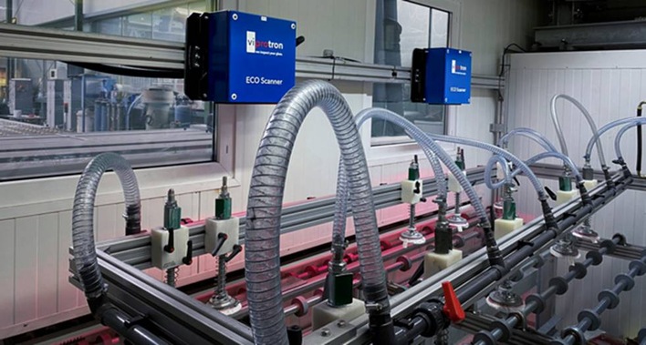 Two camera heads installed in the clean room of a lamination line.