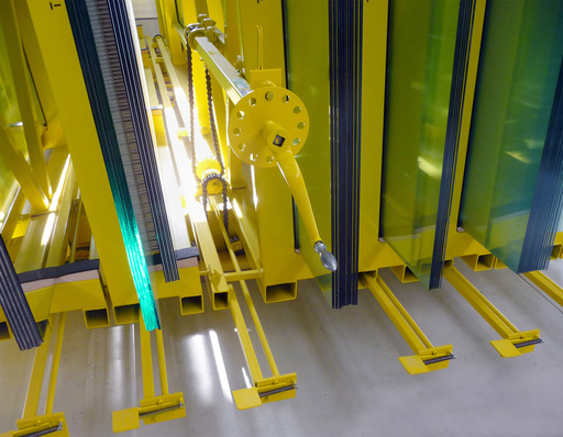 Manual compact storage system for glass panes. Because they run on specific tracks, each storage rack can be removed individually.