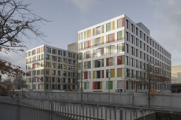 The new building with its colourful glass facade has an H-shaped floor plan.